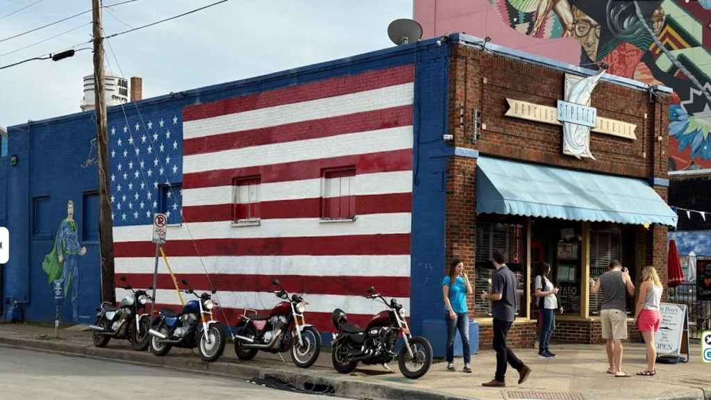 Colorful murals and neon lights lining the streets of Deep Ellum Dallas